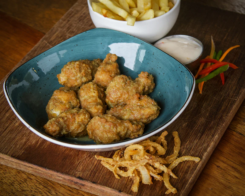 Bowl of crispy popcorn chicken bites