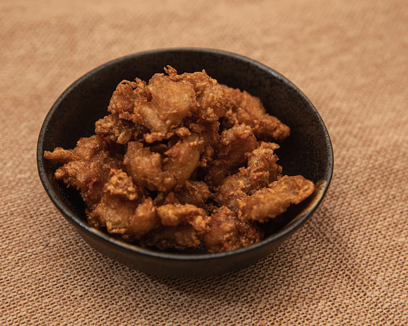 Bowl of crispy glazed popcorn chicken bites